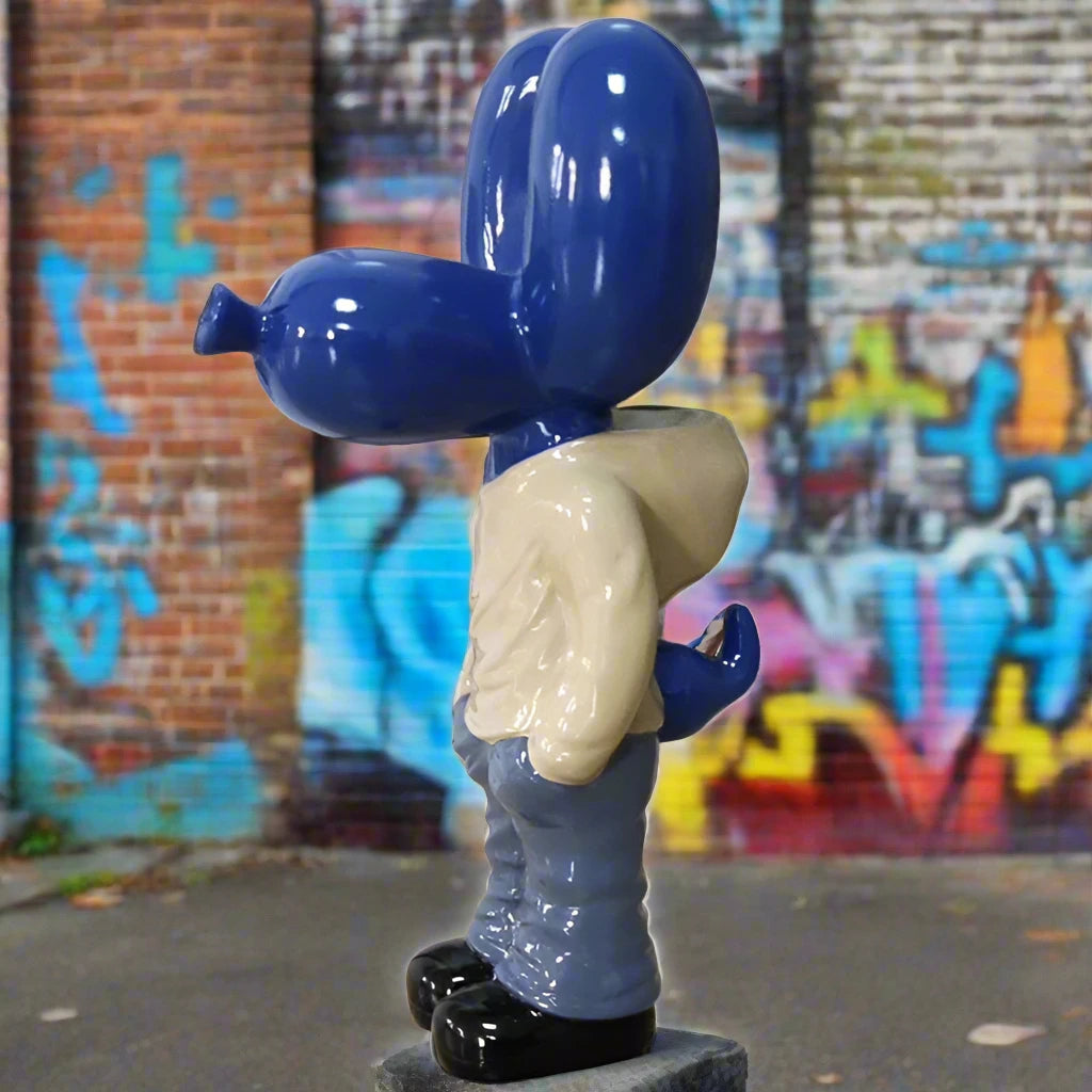 Compact pink Hands In Pocket Balloon Dog statue, a tribute to Jeff Koons' iconic art