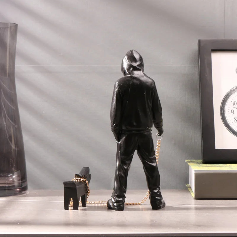 Front view of Banksy Inspired Man with Dog Sculpture