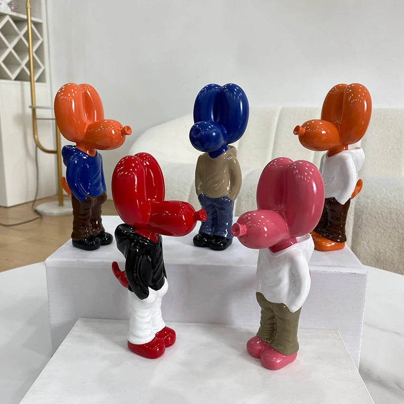 Miniature Jeff Koons inspired Hands In Pocket Balloon Dog statue in pink, crafted from high-quality resin