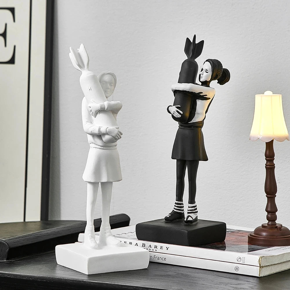 Minimalist Banksy Hugging Bomb Girl statue in black and white, perfect for contemporary art lovers