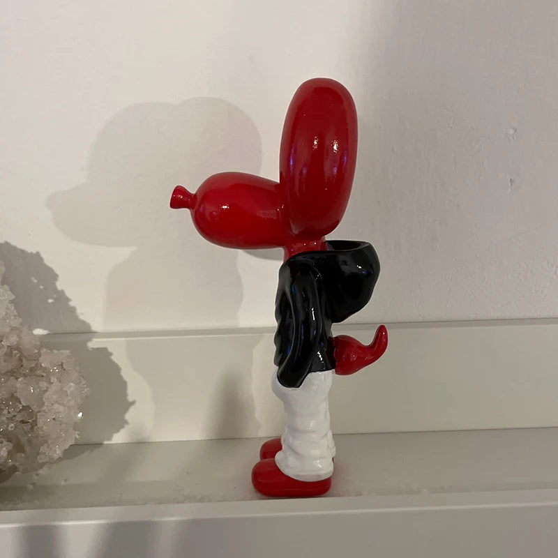 Red Hands In Pocket Balloon Dog statue with a glossy resin finish, inspired by Jeff Koons