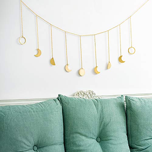 Stylish gold metal wall art featuring intricate celestial motifs